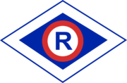 Grafika przedstawiająca literę R w rombie, symbol ruchu drogowego.