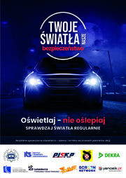 Plakat „Twoje Światła – Nasze Bezpieczeństwo”. 
Plakat w formie prostokąta w pionie. Na ciemno granatowym tle świecące przednie reflektory pojazdu, nad nimi napis „Twoje światła nasze bezpieczeństwo”.